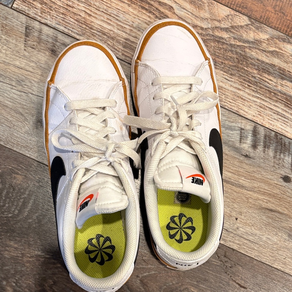 Nike Womens White Sneakers with Black Swoosh and Gold Trim